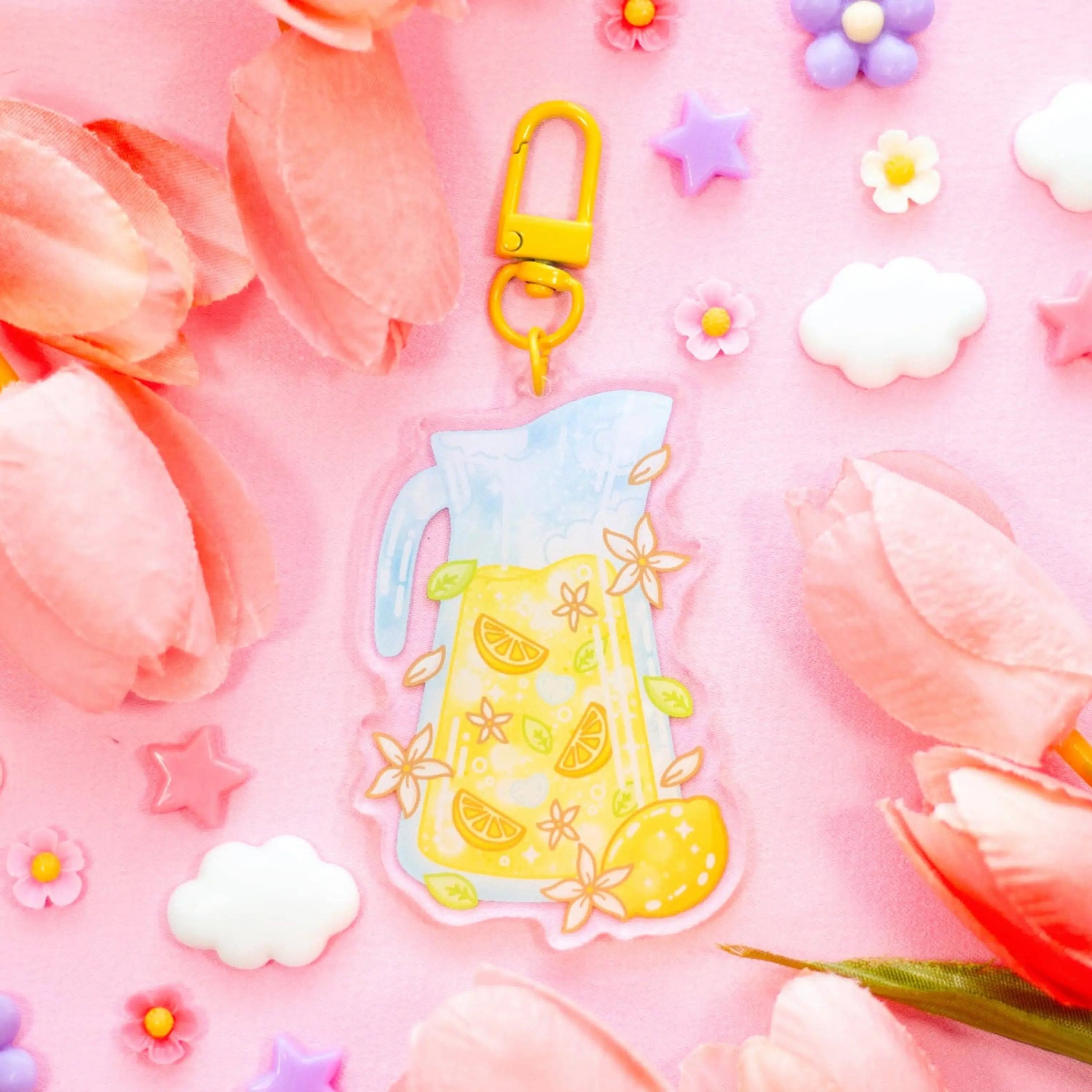Colorful keychain with a lemon design on a pink floral background