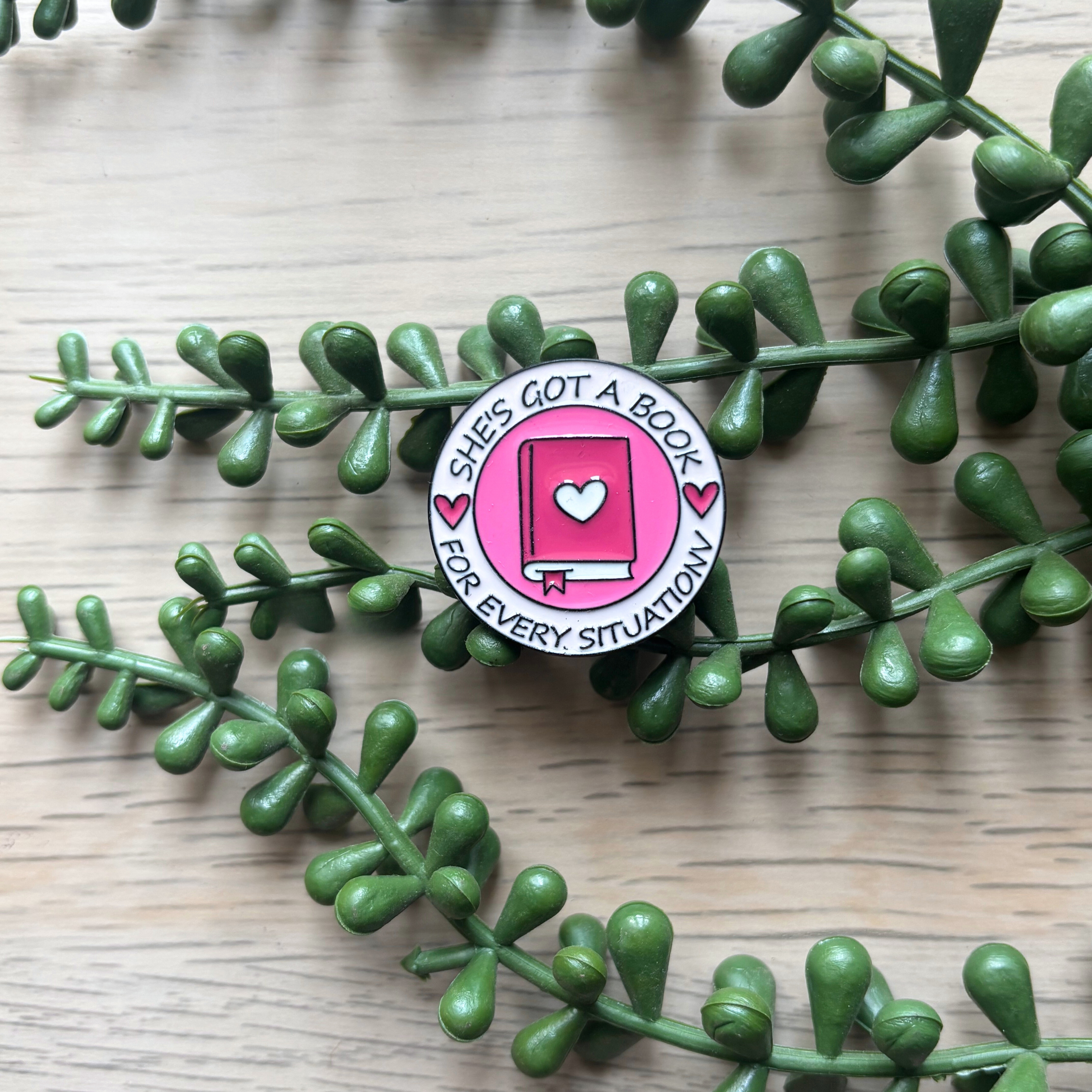 She's got a book Pin