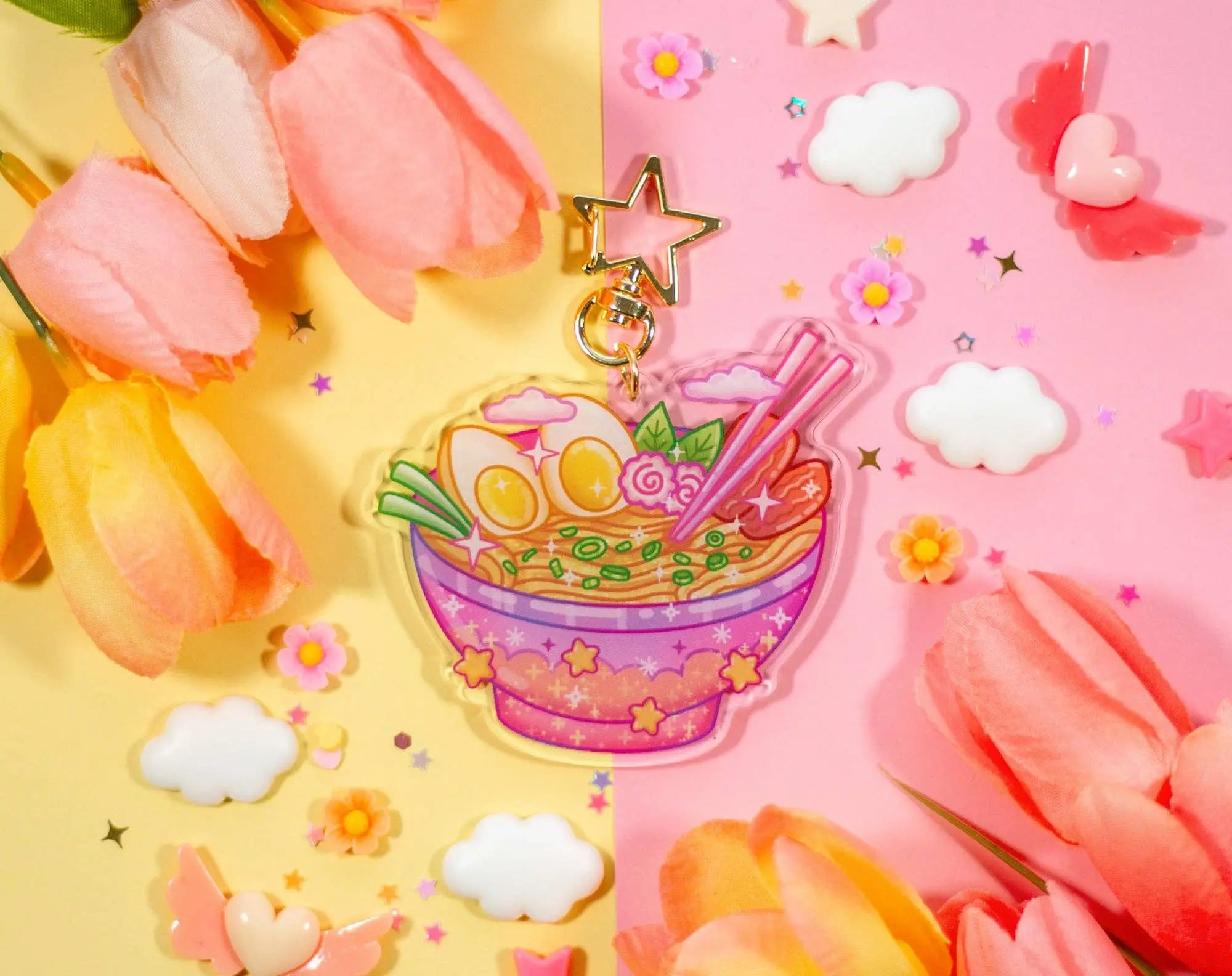 Kawaii-themed keychain with a bowl of ramen, flowers, and clouds on a colorful background