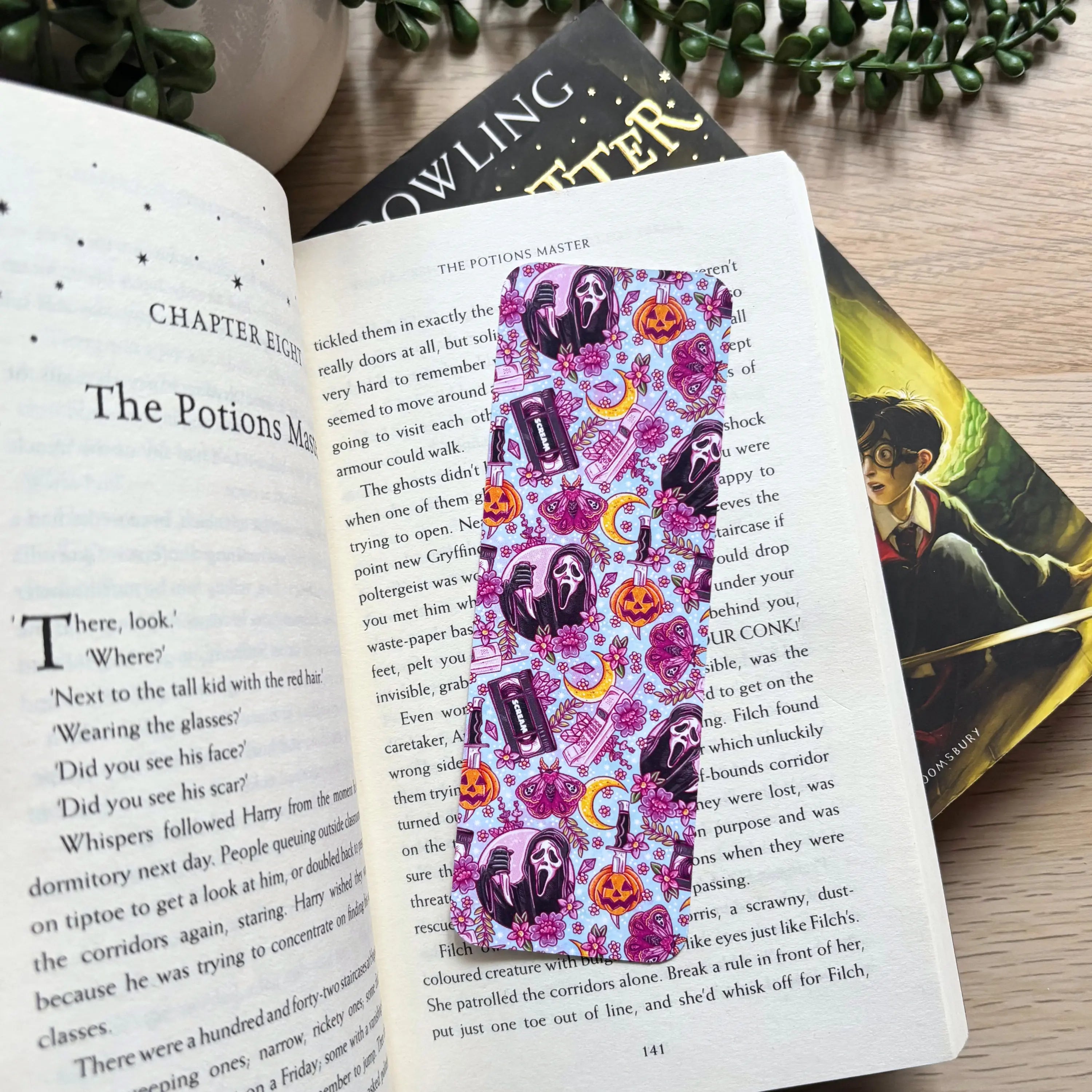 Pastel purple bookmark on book page.